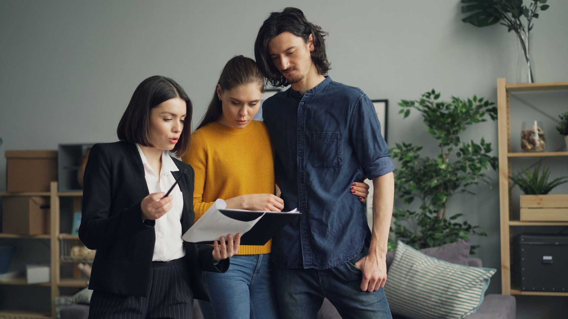 Couple reviewing apartment details with an agent